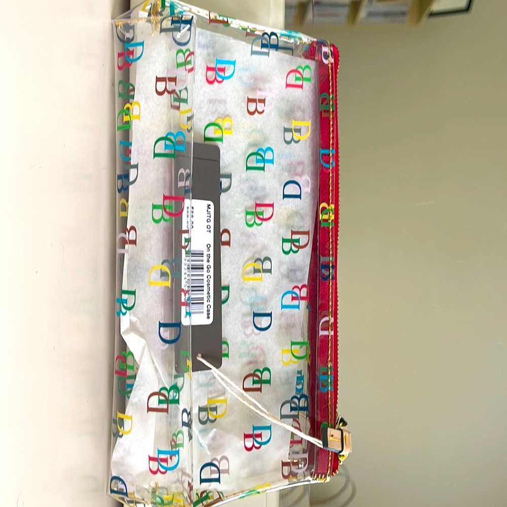 Dooney and Burke clear monogram makeup bag.